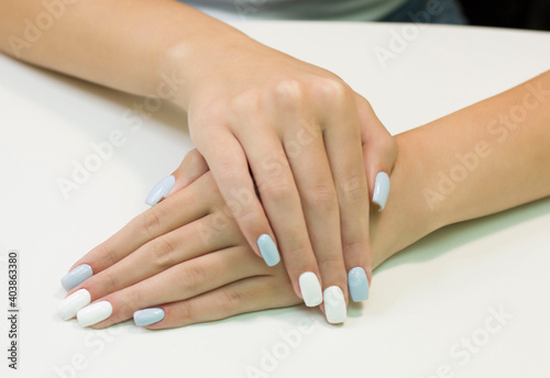 two-tone manicure with blue and white nail Polish