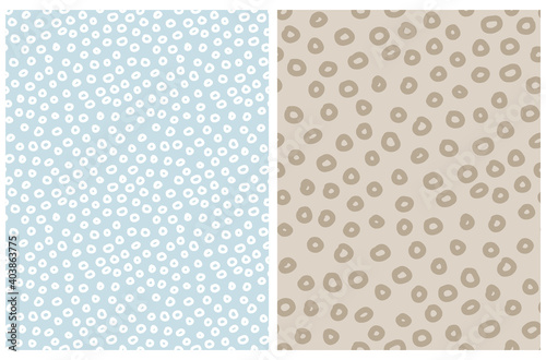 Fototapeta Naklejka Na Ścianę i Meble -  Seamless Geometric Vector Pattern. Simple Irregular Abstract Dotted Print with Brown and White Hand Drawn Circles Isolated on a Beige and Pastel Blue Background. Template with Confetti Rain Design.