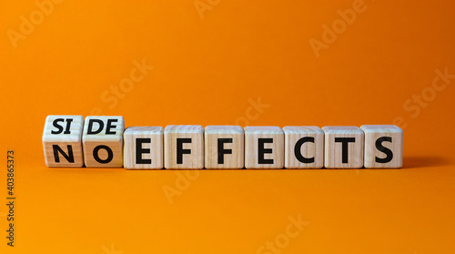 Side or no effects symbol. Turned wooden cubes and changed words 'no effects' to 'side effects'. Beautiful orange background, copy space. Medical, covid-19 pandemic corona side effects concept.