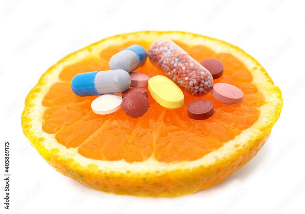 Sliced orange with pills. Sliced orange with pills.