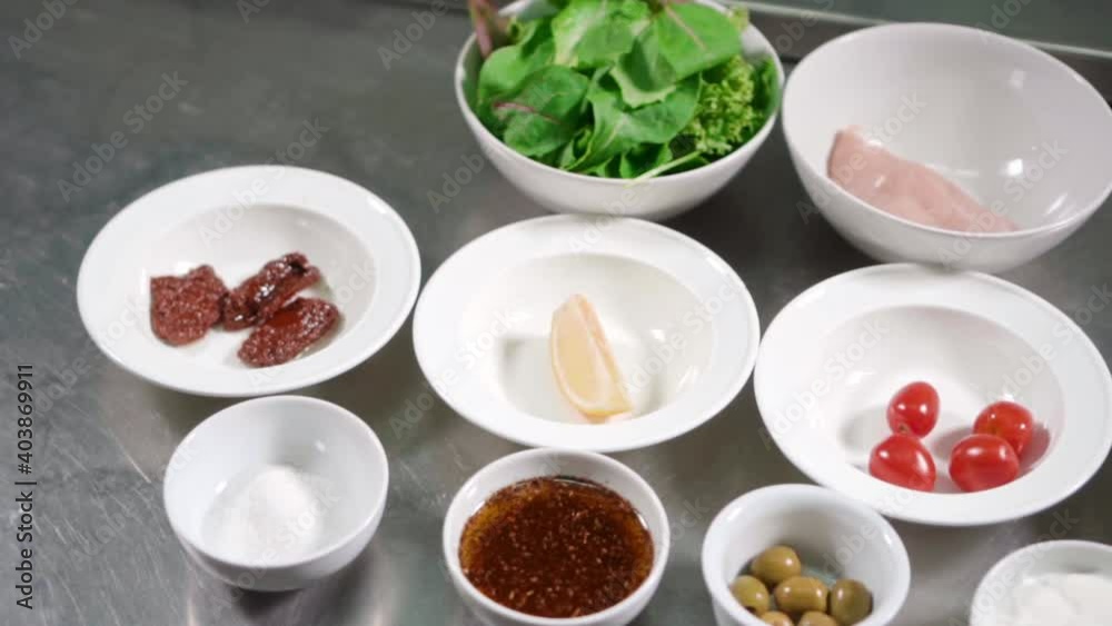 Food ingredients on plates for cooking on metal table background Food ingredients on plates for cooking on metal table background