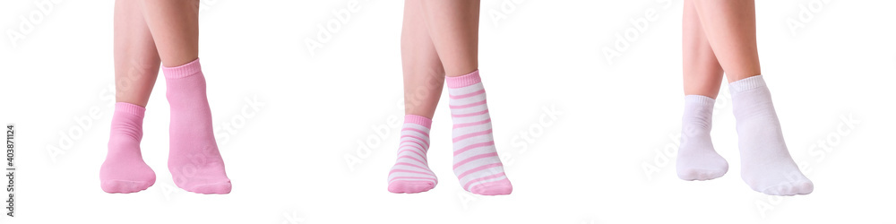 Beautiful female woman legs in cotton cozy socks of white and pink color isolated on white, banner for web, warm natural organic hosiery Beautiful female woman legs in cotton cozy socks of white and pink color isolated on white, banner for web, warm natural organic hosiery