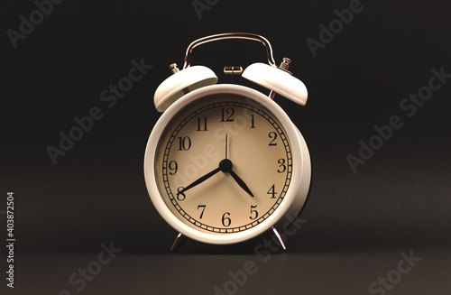 Alarm clock on black background isolated photo