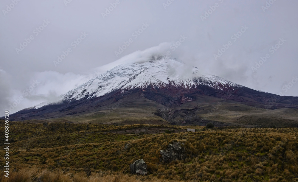 Fototapeta premium The Cotopaxi volcano in the clouds, Cotopaxi National Park, Ecuador