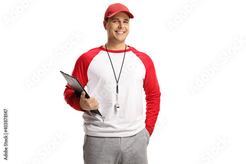 Baseball coach with a whistle around his neck and a clipboard in his hands