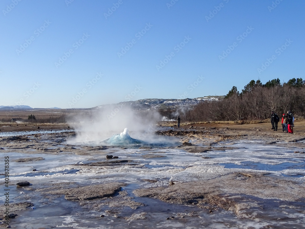 Strokkur geyser in Iceland, during winter road trip.