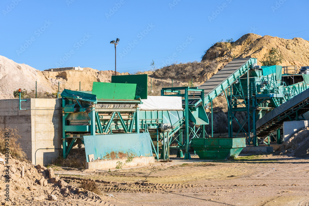 Obraz premium Machinery in a rock quarry to crush and sand the stone.