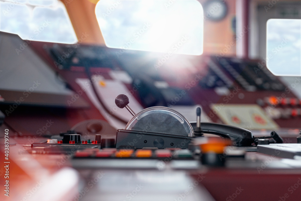 Ship's control bridge dashboard with navigation equipment on the vessel bridge. Ship's control bridge dashboard with navigation equipment on the vessel bridge.