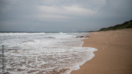 Fototapeta Naklejka Na Ścianę i Meble -  Beautiful coast of the Indian Ocean in cloudy weather.