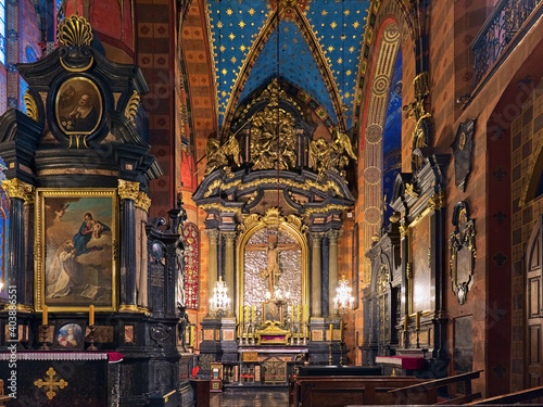 Krakow, Poland. Baroque altar of the Holy Cross in the southern nave of St. Mary's Basilica with Crucifix of Veit Stoss. The crucifix was created in 1496 by the German sculptor Veit Stoss. © Mikhail Markovskiy