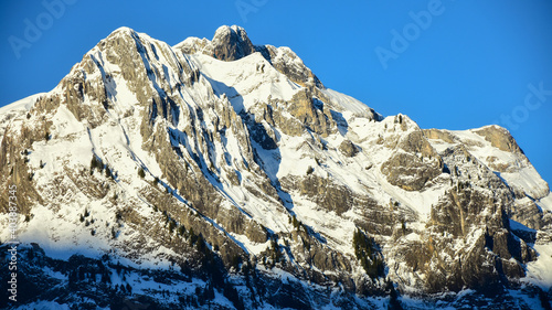 Rocky, sharp and snowed mountain peaks seen from Titlis Glacier. Switzerland, Alps.
