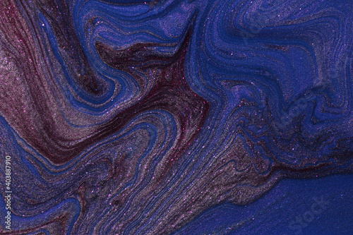 Blue and violet shimmer abstract background. Make up concept.Beautiful stains of liquid nail laquers.Fluid art,pour painting technique.Horizontal banner,good as backdrop,copy space for design. photo