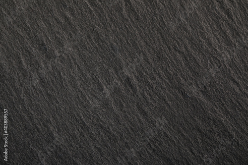 Black stone background. Dark gray banner with concrete wall surface texture.