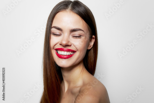 Woman Laughter and closed eyes with bare shoulders charming look 