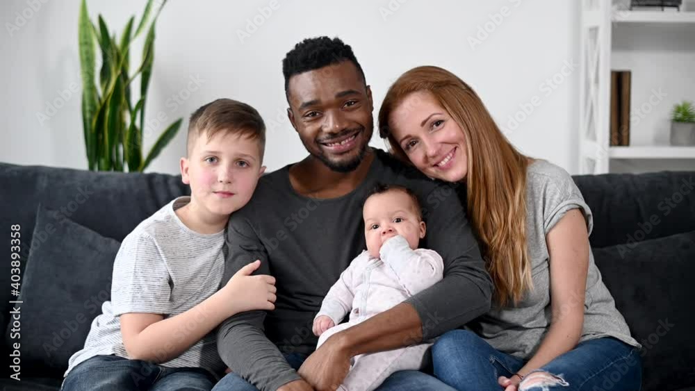 Webcam view of happy multiracial family of four. Interracial ...