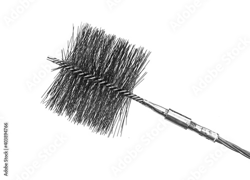 Valokuva A chimney metal brush with steel cable isolated over a white background