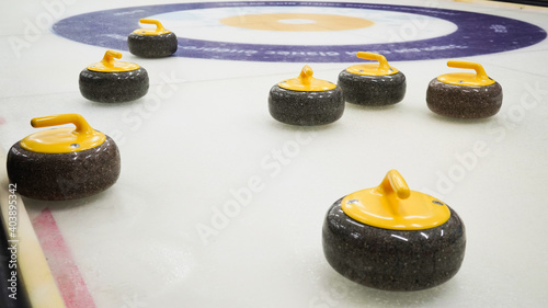 Granite stones for curling on white ice close-up.Winter sport, team game.Curling Club.