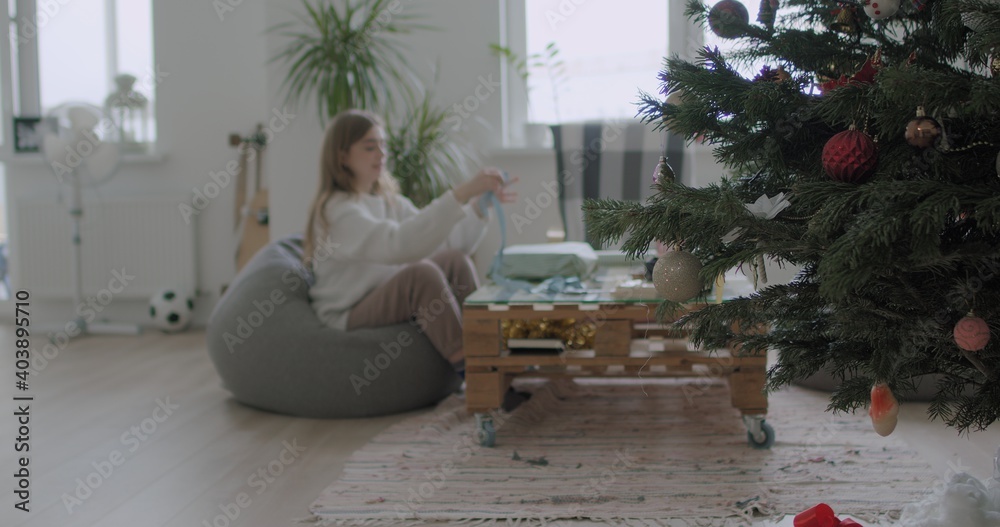 Woman wrapping Christmas presents gift Woman wrapping Christmas presents gift