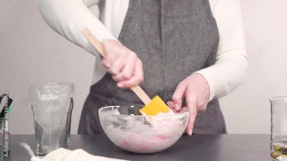 Step by step. Mixing in food coloring into the royal icing to decorate sugar cookies. Step by step. Mixing in food coloring into the royal icing to decorate sugar cookies.
