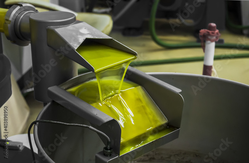 Fototapeta Closeup shot of an olive oil extraction process in a factory