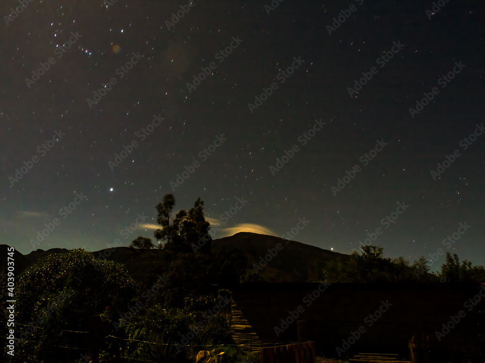 Long exposure night landscape illuminated by the full moon, near the colonial town of Villa de Leyva in the central Andean mountains of Colombia.