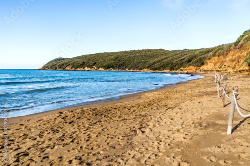 Fototapeta Naklejka Na Ścianę i Meble -  The sandy beach of the Gulf of Baratti, in the municipality of Piombino, along the Etruscan Coast, province of Livorno, Tuscany, Italy