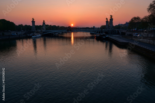 sun rising over the river seine and Pont Alexandre III bridge in Paris © Mosaferi_Paris