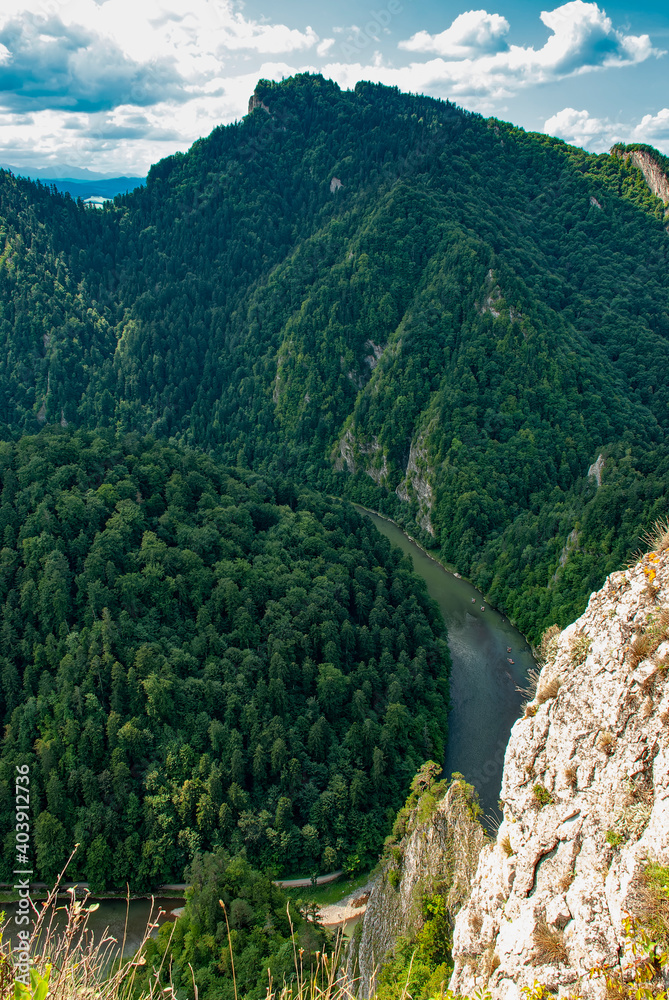 A view of the Dunajec River Gorge, on the right you can see the limestone rocks of the top of the Sokolica mountain. Pieniny National Park, Poland.