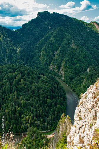 A view of the Dunajec River Gorge, on the right you can see the limestone rocks of the top of the Sokolica mountain. Pieniny National Park, Poland.