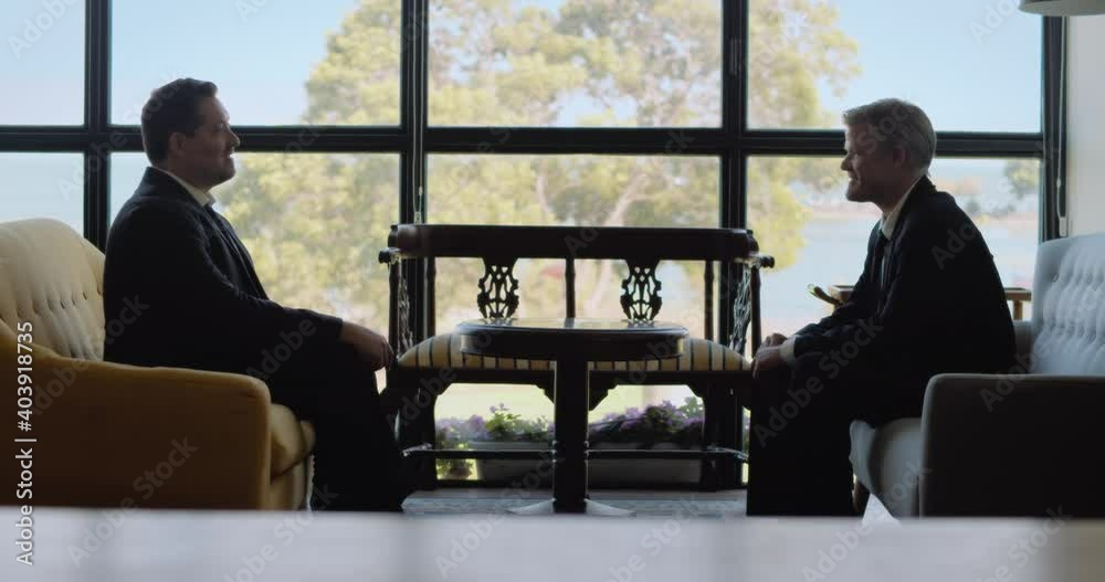 Two men finish business meeting, they handshake and walk away. Real time, long shot. Two men finish business meeting, they handshake and walk away. Real time, long shot.
