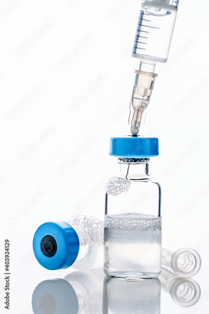 Close up on syringe with needle and vaccine injection isolated on white background - covid-19 vaccination concept healthcare and medicine Close up on syringe with needle and vaccine injection isolated on white background - covid-19 vaccination concept healthcare and medicine