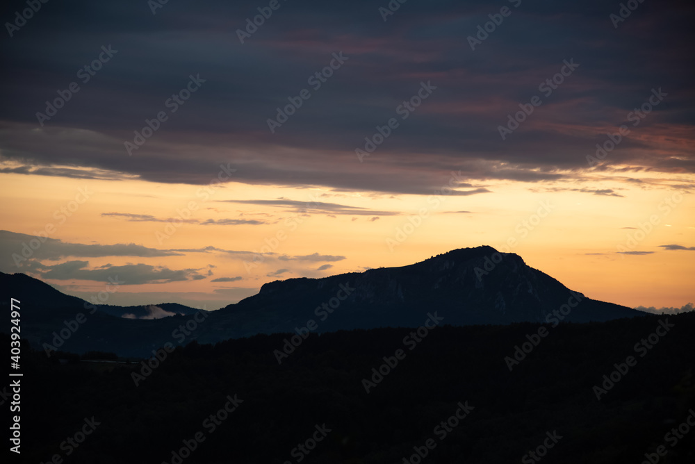 Scenic canyon view of meanders on the river Uvac, on the Zlatar Mountain with beautiful sunset with colorful and dramatic clouds and sky in background. Uvac is a special nature reserve in Serbia. Scenic canyon view of meanders on the river Uvac, on the Zlatar Mountain with beautiful sunset with colorful and dramatic clouds and sky in background. Uvac is a special nature reserve in Serbia.
