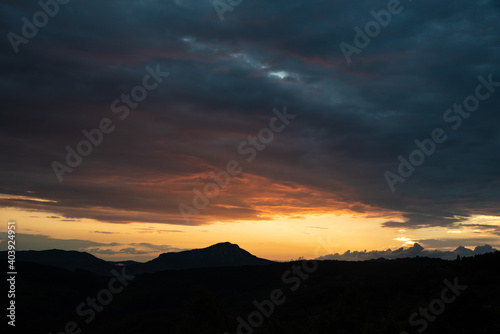 Scenic canyon view of meanders on the river Uvac, on the Zlatar Mountain with beautiful sunset with colorful and dramatic clouds and sky in background. Uvac is a special nature reserve in Serbia.
