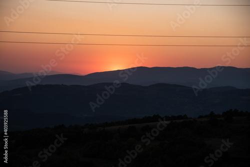 Impressive and scenic view of colorful and dramatic sunset, from a high peak of Old mountain, a view to surrounding peaks and highlands as midzor and other peaks at summer evening.
Old Mountain,Serbia photo