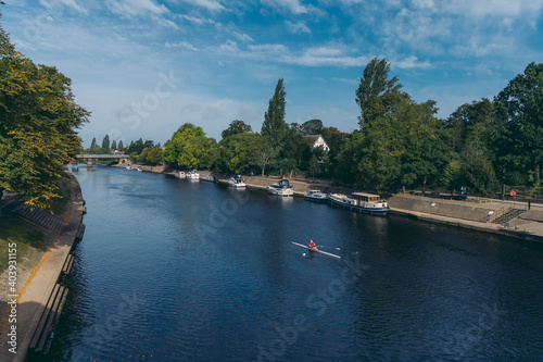 Rowers on the river Ouse on sunny weekend morning photo