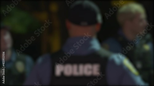 Police Officers Talking Outside Night OTS Blurry 4K