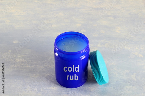 herbal ayurvedic cold rub with cold rub text isolated in jar for cold,cough,flu,pain analgesic,virus protection  photo