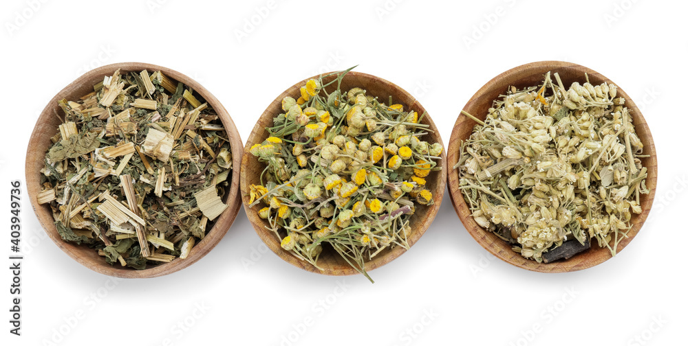 Fototapeta premium Bowls with different herbs on white background