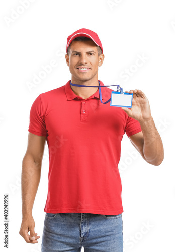 Young man with blank badge ...