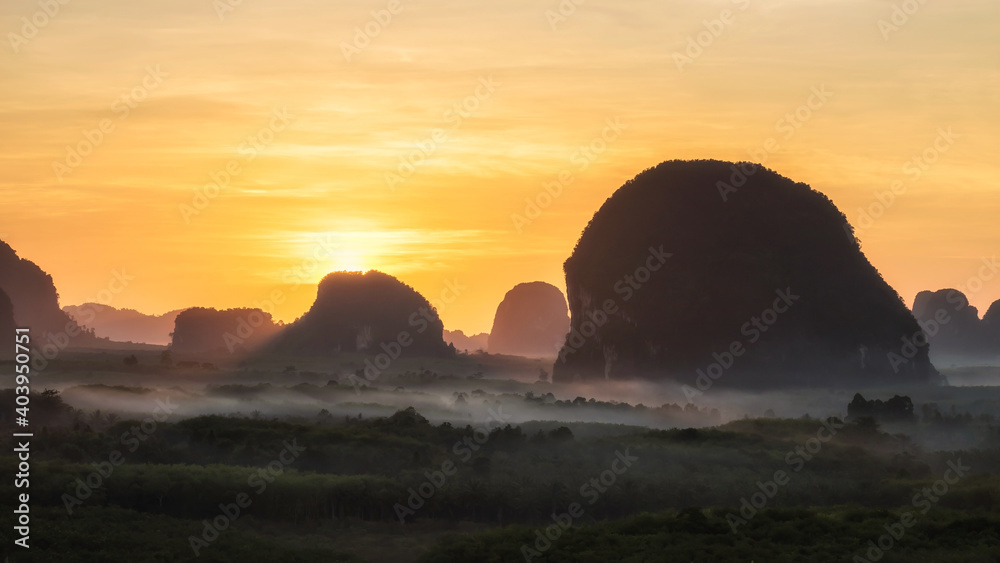 sunrise at karst mountains with mist, Krabi