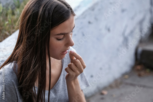 Photos Female junkie taking drugs outdoors