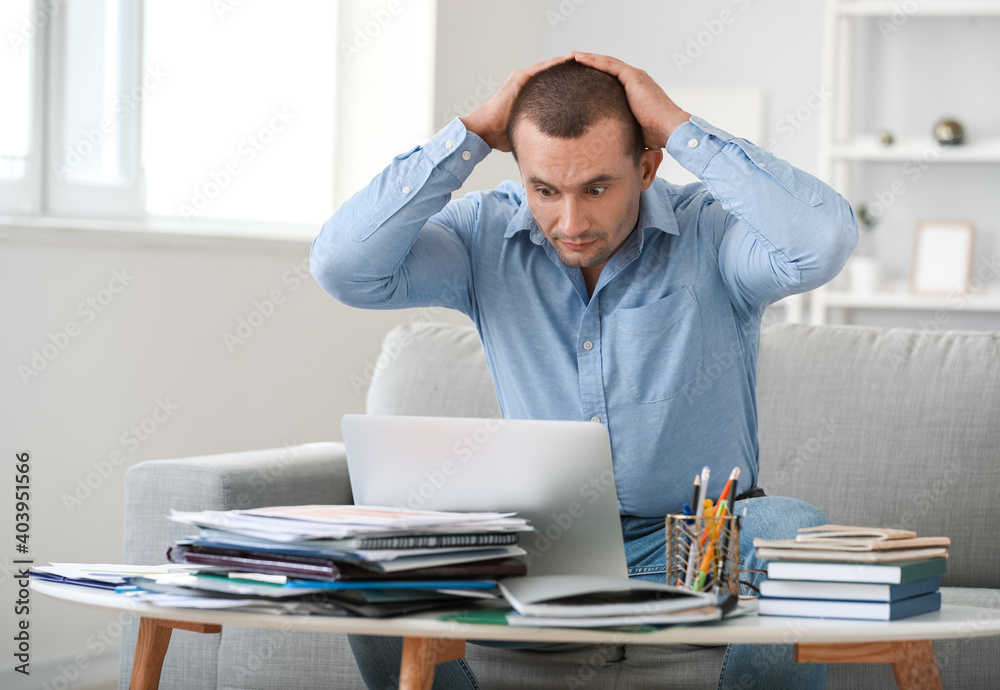 Stressed businessman trying to meet deadline in office Stressed businessman trying to meet deadline in office