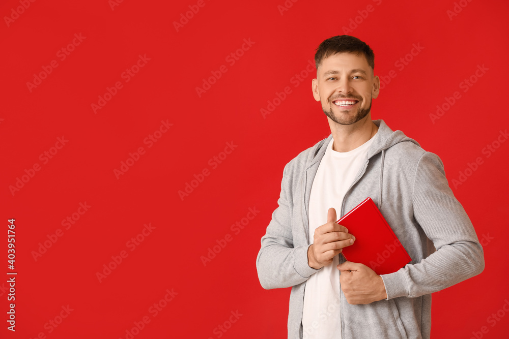 Man with book on color background Man with book on color background