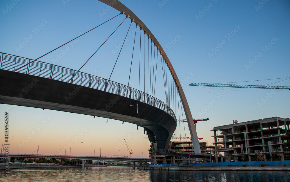 Dubai, UAE - 01.08.2021 Bridge over a Dubai Water canal known as Tolerance bridge. Outdoors Dubai, UAE - 01.08.2021 Bridge over a Dubai Water canal known as Tolerance bridge. Outdoors