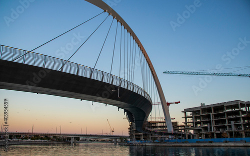 Dubai, UAE - 01.08.2021 Bridge over a Dubai Water canal known as Tolerance bridge. Outdoors © Four_Lakes