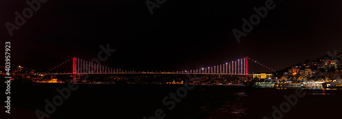 Obraz na płótnie A panoramic of the Bosphorus Bridge 1, officially known as the 15 July Martyrs Bridge, taken at night in January 2021 from the Asian side of Istanbul Turkey. w salonie