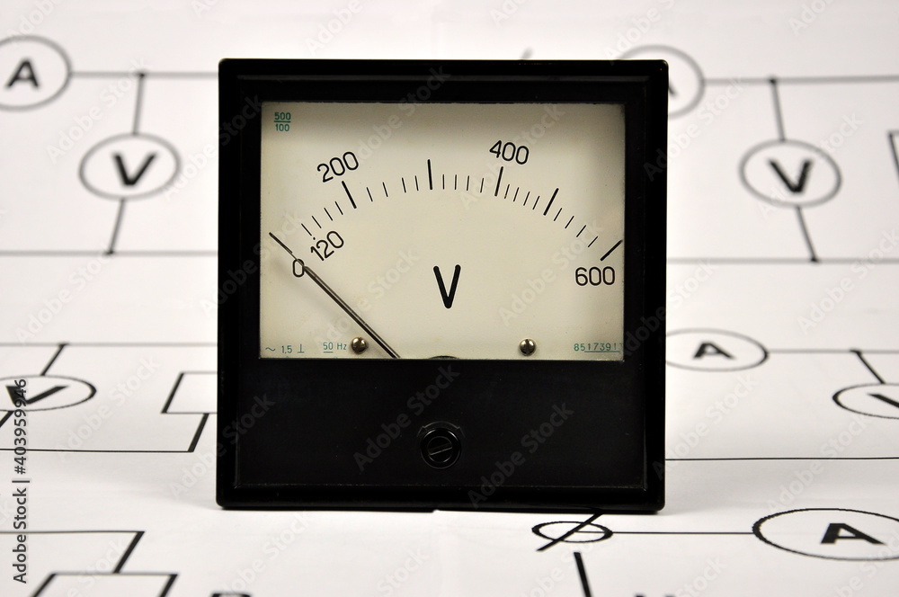 Basic electrical diagram and a black old voltmeter. Basic electrical diagram and a black old voltmeter.