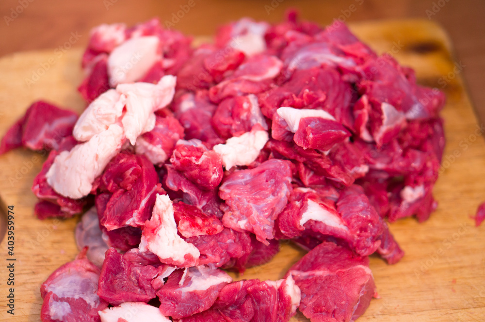 Chopped beef meat on the butcher's table. Beef meat in chunks. Chopped beef meat on the butcher's table. Beef meat in chunks.