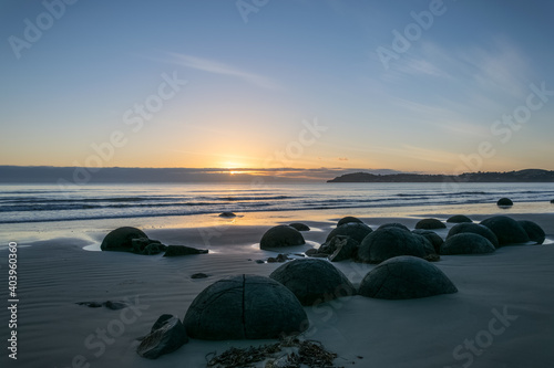 Canvastavla Moeraki Boulders on a beach by sunrise, New Zealand
