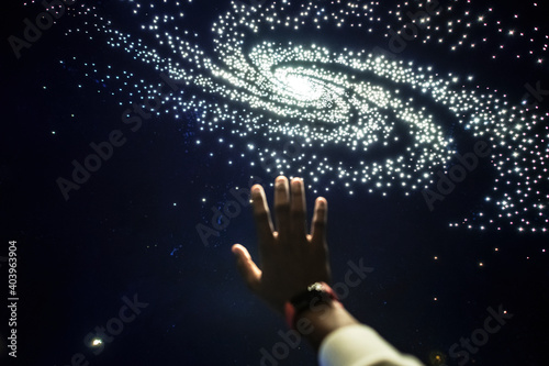 Man experiencing the universe at a planetarium photo